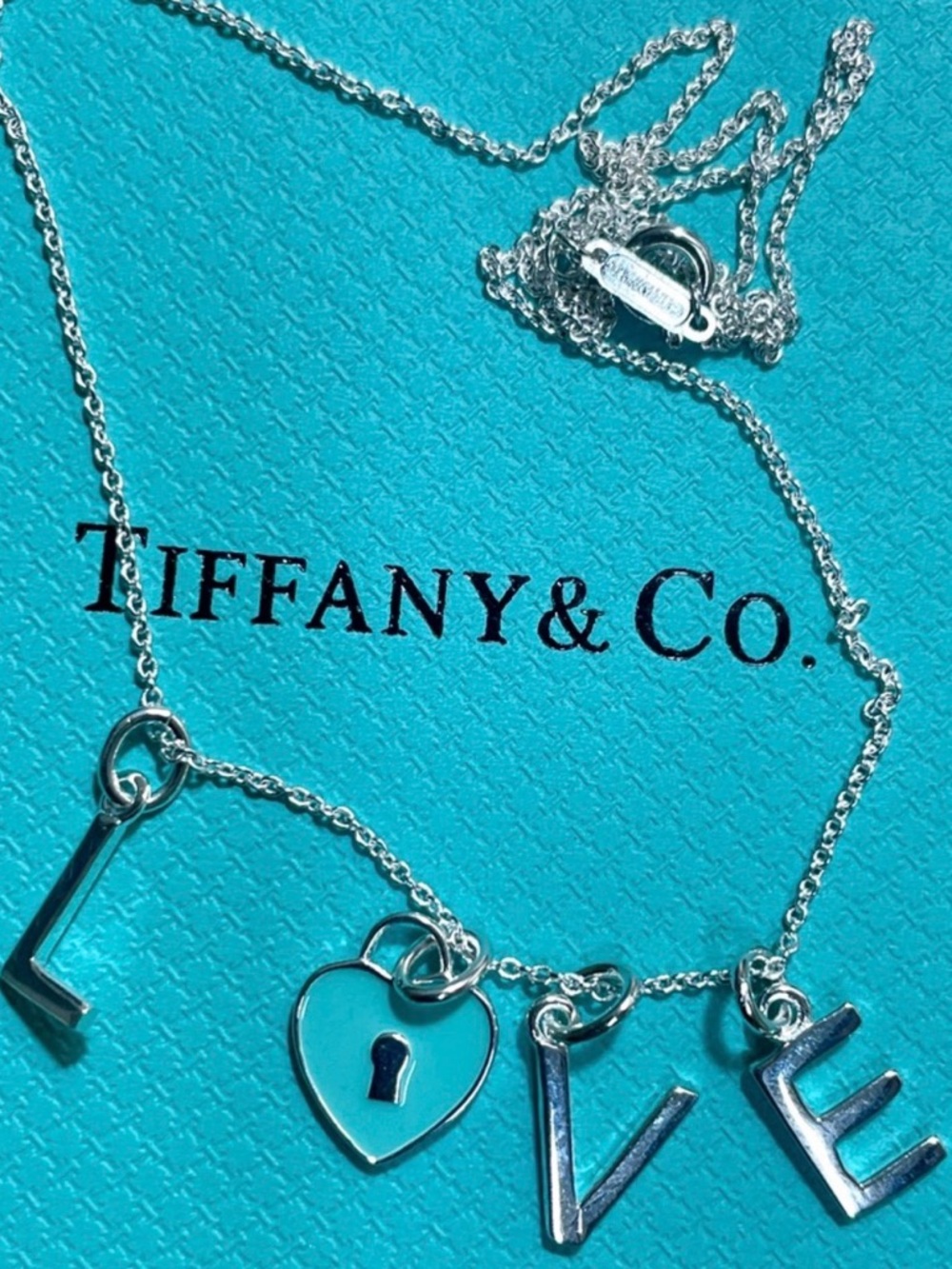 Tiffany & Co. Silver 'LOVE' Letter Necklace with Blue Heart Padlock